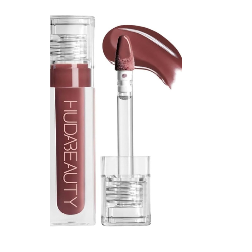 Huda Beauty lip product with applicator on a white background